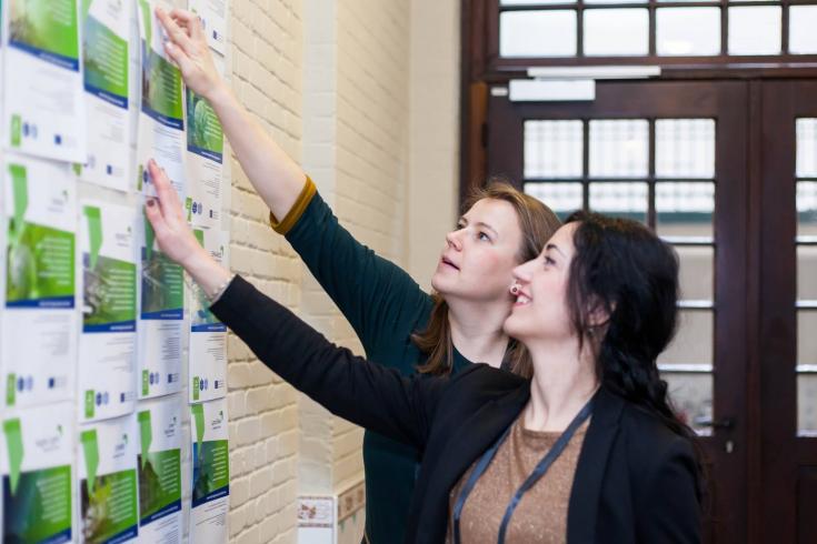 Two women looking at pamphlets